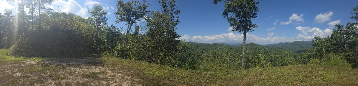 Lot 4 panoramic view: a wide photograph of the property and its surroundings