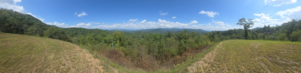 Lot 6 panoramic view: a wide photograph of the property and its surroundings
